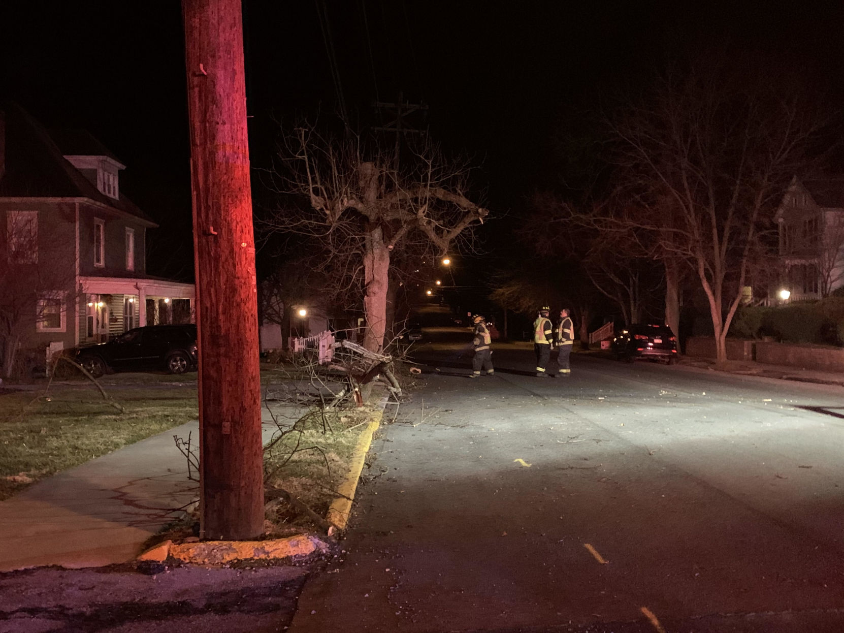 Damaged tree blocks street in Bedford